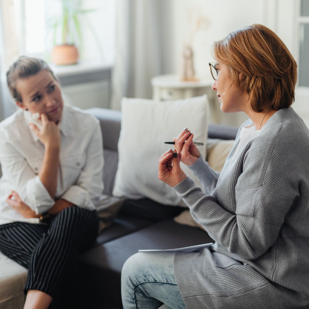 A psychologist speaking with a client